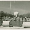 Theme Center - Trylon and Perisphere - View across grounds with workers laying concrete
