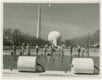 Theme Center - Trylon and Perisphere - View across grounds with workers laying concrete