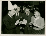 Ticket Sales - Fred Allen selling ticket books to woman and two men