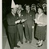 Ticket Sales - Fred Allen selling ticket books to woman and two men