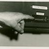 Ticket Sales - Hand pointing to apparatus calculating Fair attendance
