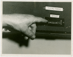 Ticket Sales - Hand pointing to apparatus calculating Fair attendance