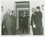 Town of Tomorrow - Fiorello LaGuardia cutting tape while Harvey Gibson, Grover Whalen and others look on