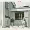Town of Tomorrow - Construction - Two workers constructing brick wall