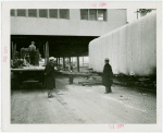 Trains - Men standing next to shrouded train