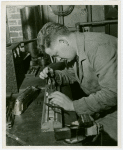 Trains - Miniature - Man repairing miniature trains