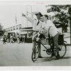 Transportation to Fair - Attendant giving boy on bike directions