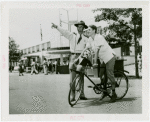Transportation to Fair - Attendant giving boy on bike directions