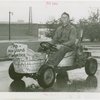 Transportation to Fair - Man in go-cart made of bathtubs