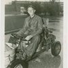 Transportation to Fair - Man in go-cart made of bathtubs