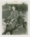 Transportation to Fair - Man in go-cart made of bathtubs