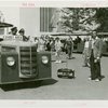 Transportation to Fair - Hitchhikers - Man and mechanical hand in suitcase