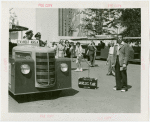 Transportation to Fair - Hitchhikers - Man and mechanical hand in suitcase
