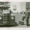 Transportation to Fair - Hitchhikers - Man and mechanical hand in suitcase