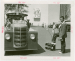 Transportation to Fair - Hitchhikers - Man and mechanical hand in suitcase