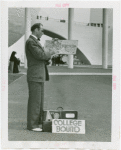 Transportation to Fair - Hitchhikers - Man with map and suitcase