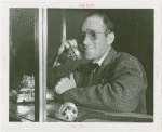 Transportation to Fair - Hitchhikers - Man talking on telephone
