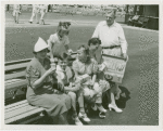 Typical American Family - Family eating lunch on bench