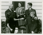 Typical American Family - Family receiving key and lease from Harvey Gibson