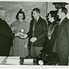 Typical American Family - Family receiving signed baseball and charm bracelet from Harvey Gibson
