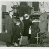 Typical American Family - Armes family receiving key and lease from Harvey Gibson