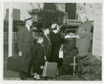 Typical American Family - Armes family receiving key and lease from Harvey Gibson