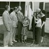 Typical American Family - Arvin family raising Illinois flag with Harvey Gibson