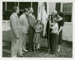 Typical American Family - Arvin family raising Illinois flag with Harvey Gibson