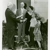 Typical American Family - Arvin family receiving key and lease from Harvey Gibson