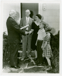 Typical American Family - Arvin family receiving key and lease from Harvey Gibson