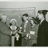 Typical American Family - Brown family children receiving signed baseball and charm bracelet from Harvey Gibson
