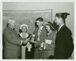 Typical American Family - Brown family children receiving signed baseball and charm bracelet from Harvey Gibson