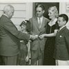 Typical American Family - Burnette family receiving key and lease from Harvey Gibson