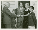 Typical American Family - Burnette family receiving key and lease from Harvey Gibson