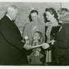 Typical American Family - Bollinger family children receiving signed baseball and charm bracelet from Harvey Gibson