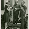 Typical American Family - Coleman family receiving key and lease from Harvey Gibson