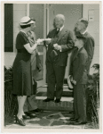 Typical American Family - Coleman family receiving key and lease from Harvey Gibson