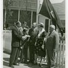 Typical American Family - Coleman family receiving key and lease from man while Harvey Gibson watches