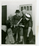 Typical American Family - Converse family receiving key and lease from Harvey Gibson