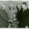 Typical American Family - Converse family children receiving signed baseball and charm bracelet from Harvey Gibson