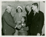 Typical American Family - Converse family children receiving signed baseball and charm bracelet from Harvey Gibson