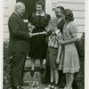 Typical American Family - Cole family receiving key and lease from Harvey Gibson