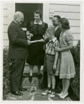 Typical American Family - Cole family receiving key and lease from Harvey Gibson