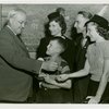 Typical American Family - Cole family children receiving signed baseball and charm bracelet from Harvey Gibson