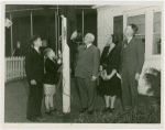 Typical American Family - Filkins family raising New York flag with Harvey Gibson