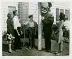 Typical American Family - Farman family raising Wisconsin flag with Harvey Gibson