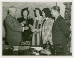 Typical American Family - Flanagan family children receiving charm bracelets from Harvey Gibson