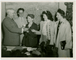 Typical American Family - Farman family children receiving signed baseball and charm bracelet from Harvey Gibson
