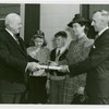 Typical American Family - Ebert family receiving key and lease from Harvey Gibson