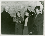 Typical American Family - Ebert family children receiving signed baseball and charm bracelet from Harvey Gibson